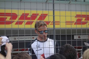 Jenson Button at Silverstone. He was shunted off at the first corner but still stayed around to sign autographs (and make my day)